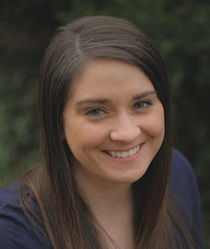Rolanda Jacobs, a young woman with brown hair